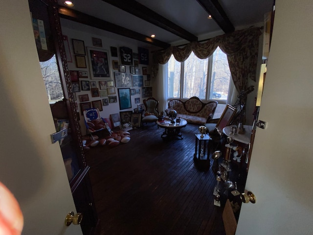 living room with hardwood / wood-style floors and beam ceiling