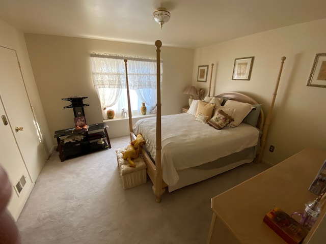 bedroom with carpet and visible vents