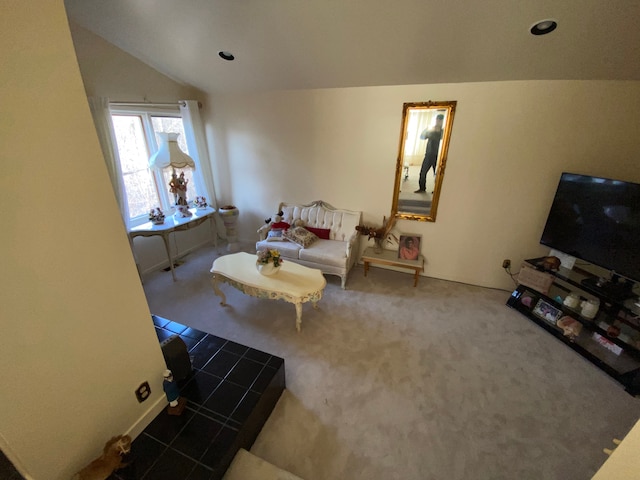 carpeted living area featuring lofted ceiling