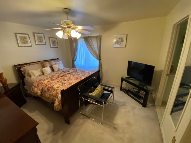 bedroom featuring ceiling fan and carpet flooring