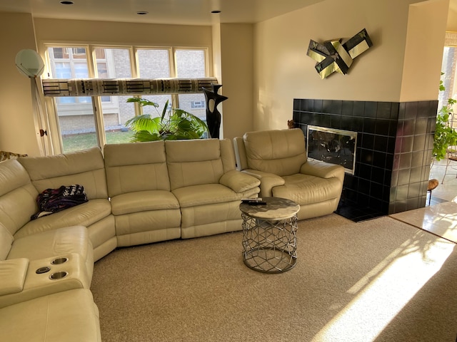 carpeted living room featuring a fireplace