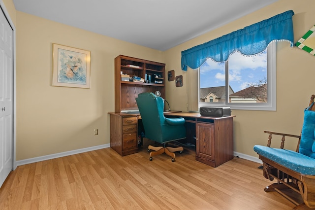 home office featuring light wood-style flooring and baseboards