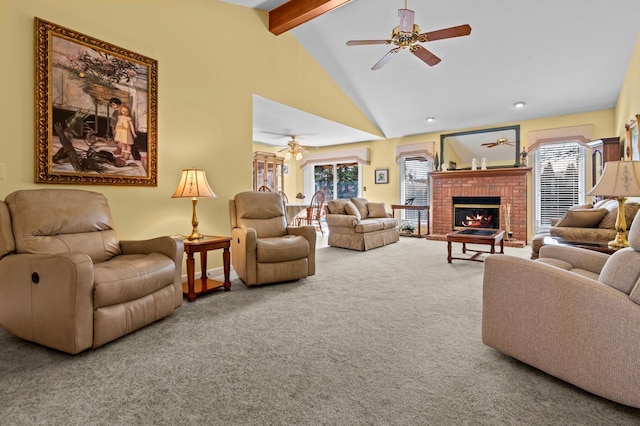 living room with ceiling fan, beam ceiling, carpet floors, and a healthy amount of sunlight