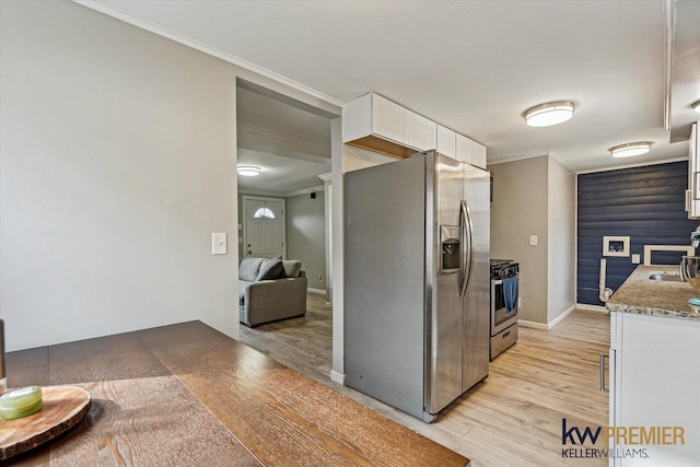 kitchen featuring white cabinetry, crown molding, light wood-style flooring, and stainless steel appliances