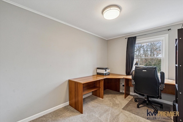 office featuring crown molding, baseboards, and light carpet