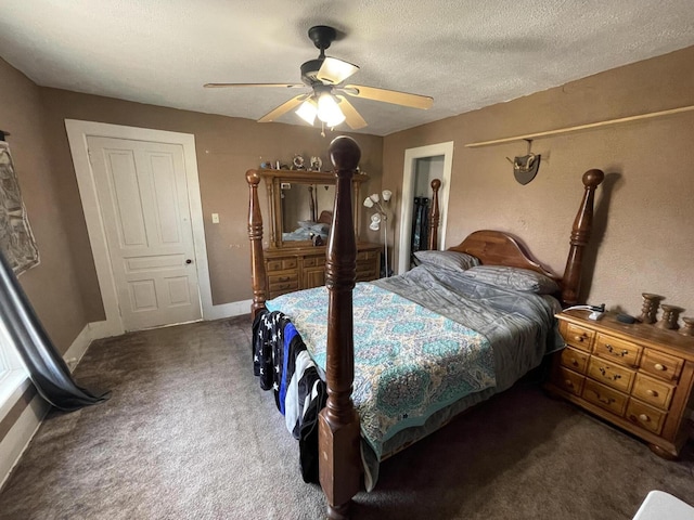 bedroom featuring a ceiling fan, baseboards, a textured ceiling, and carpet flooring