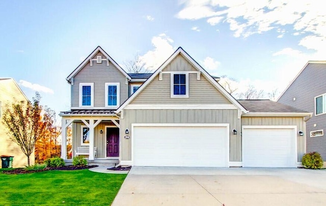 view of front of house with a front lawn, an attached garage, concrete driveway, and board and batten siding