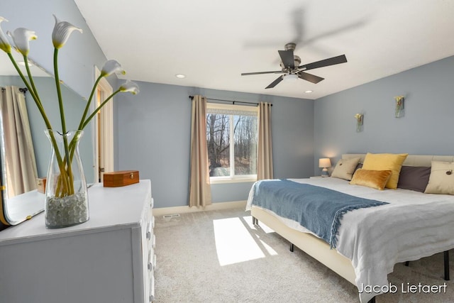 bedroom featuring a ceiling fan, baseboards, and carpet floors