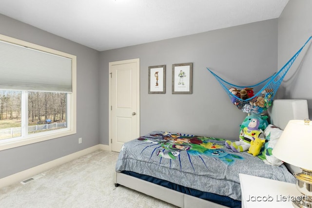 bedroom featuring visible vents, baseboards, and carpet flooring