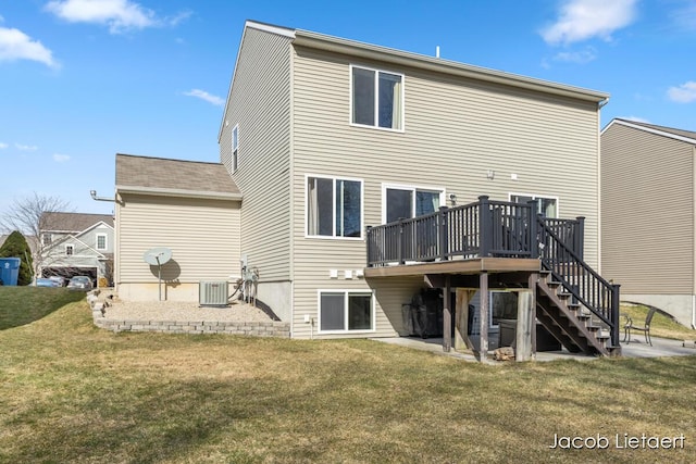 rear view of house with central air condition unit, a lawn, a patio, stairway, and a wooden deck