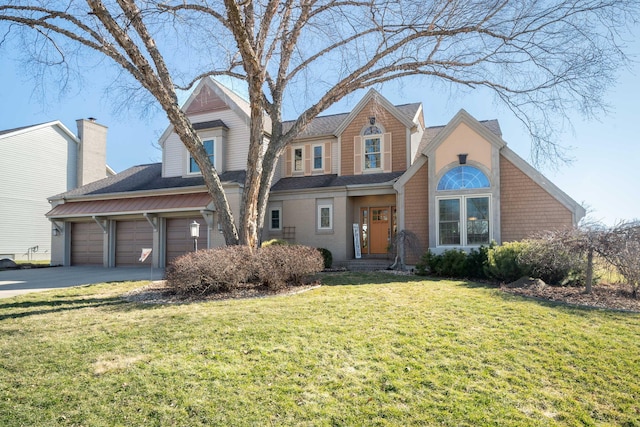 view of front of house featuring a front yard, driveway, and a chimney