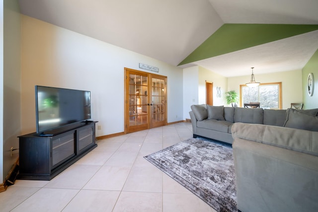 living room featuring light tile patterned floors, french doors, baseboards, and lofted ceiling