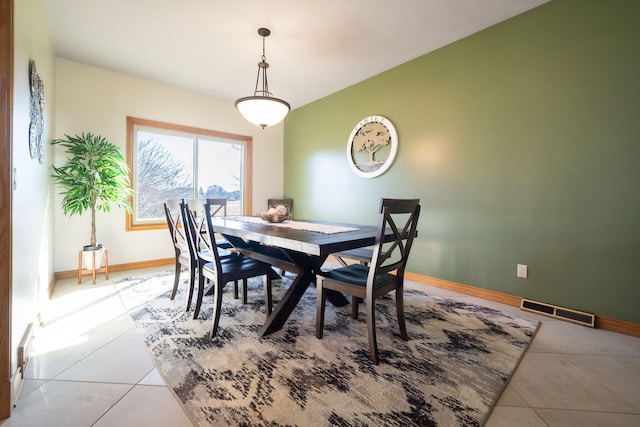 dining room featuring tile patterned flooring, visible vents, and baseboards