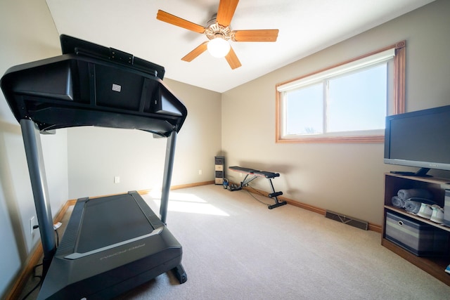 workout room featuring baseboards, carpet floors, visible vents, and a ceiling fan