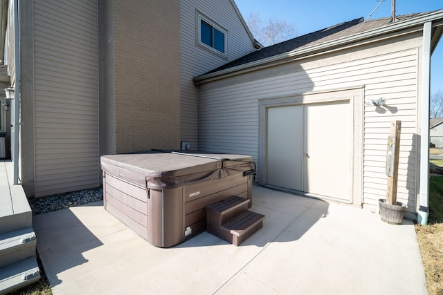 view of patio / terrace with a hot tub