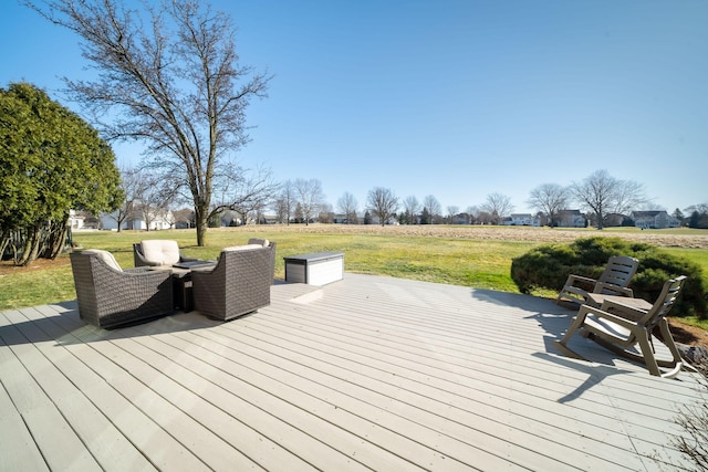 wooden terrace featuring a lawn