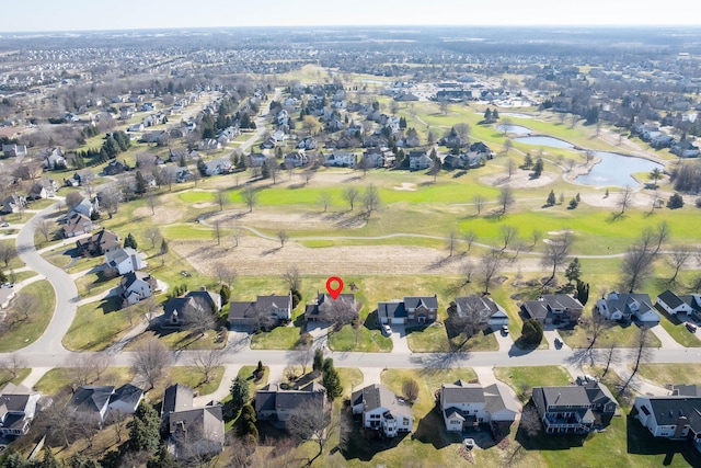 bird's eye view featuring a water view and a residential view