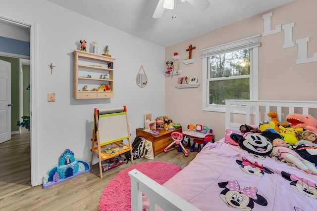 bedroom with ceiling fan and wood finished floors