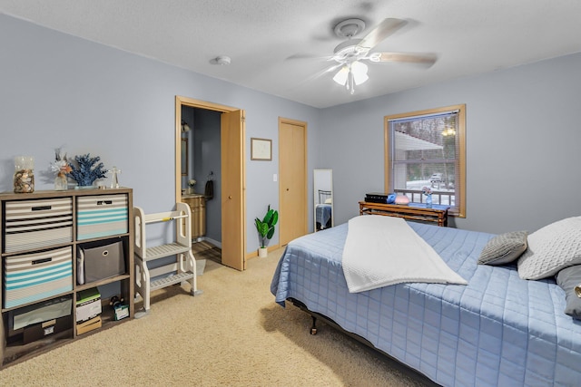 bedroom featuring light colored carpet, baseboards, and ceiling fan