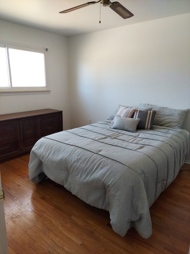 bedroom featuring ceiling fan and wood finished floors