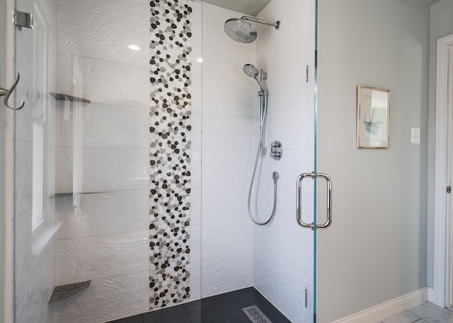 bathroom featuring a shower stall, visible vents, and baseboards