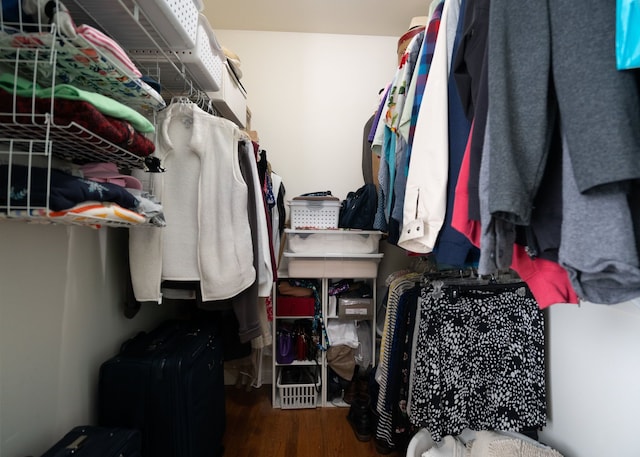 walk in closet featuring wood finished floors