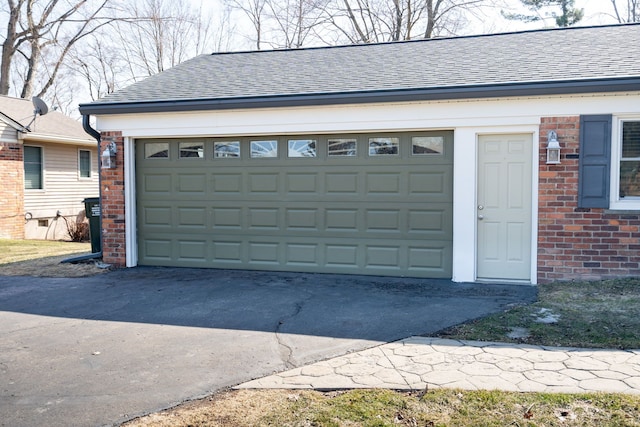 garage featuring driveway