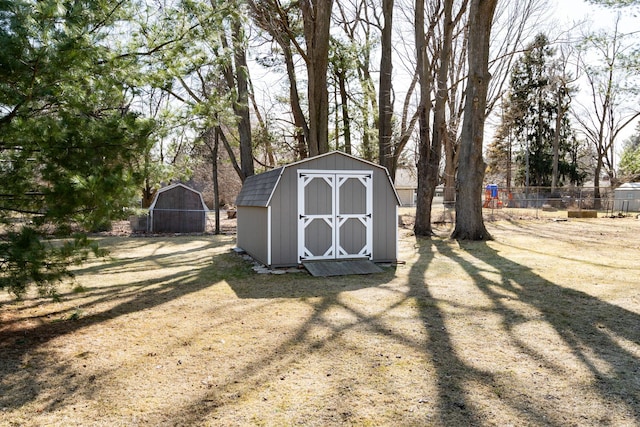 view of shed with fence