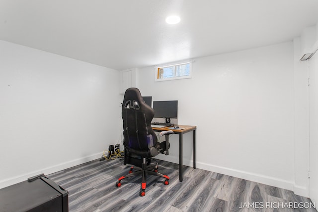 office featuring baseboards and wood finished floors