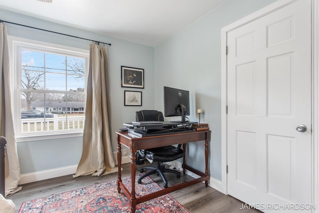 office area with wood finished floors and baseboards