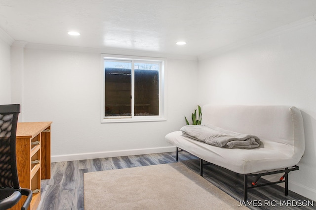 living area with recessed lighting, wood finished floors, baseboards, and ornamental molding