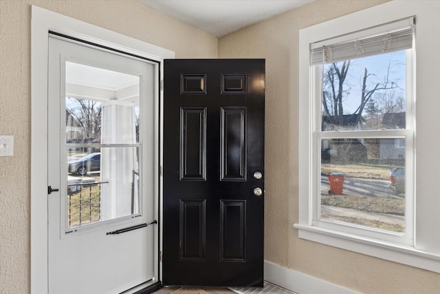 entryway with a textured wall