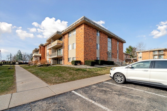 view of property featuring uncovered parking