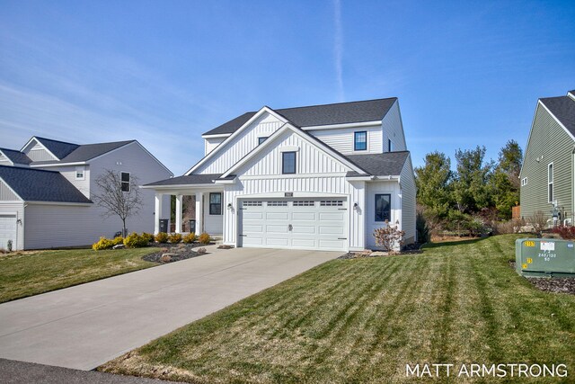 view of front facade featuring a garage, board and batten siding, concrete driveway, and a front yard