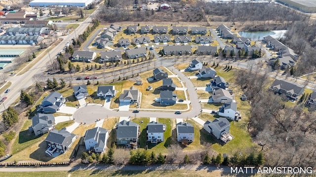 birds eye view of property with a residential view