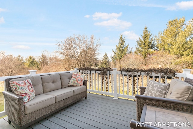 wooden terrace featuring an outdoor living space