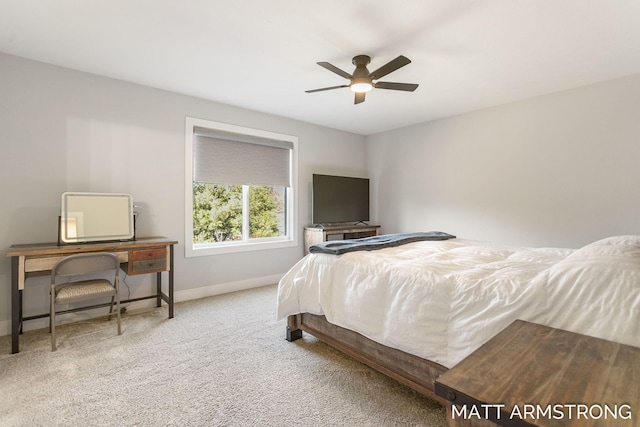 carpeted bedroom featuring baseboards and ceiling fan