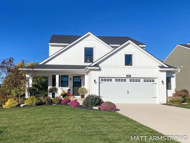 modern farmhouse featuring driveway, roof with shingles, board and batten siding, a front yard, and a garage