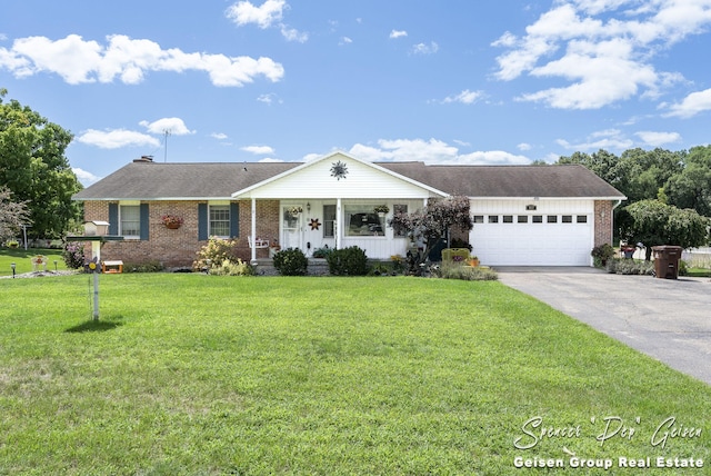 ranch-style home featuring a front lawn, brick siding, concrete driveway, and an attached garage