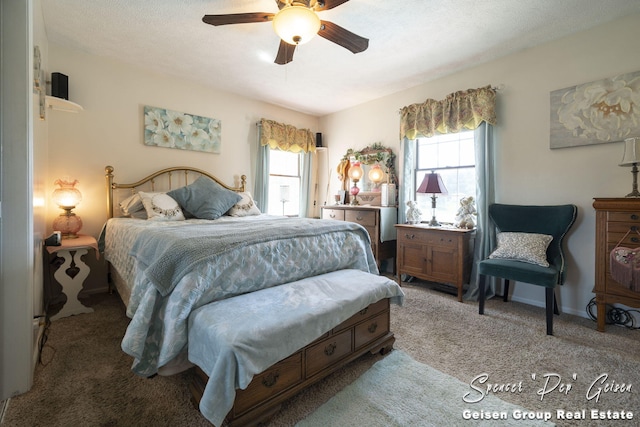 bedroom featuring carpet flooring, multiple windows, a ceiling fan, and baseboards