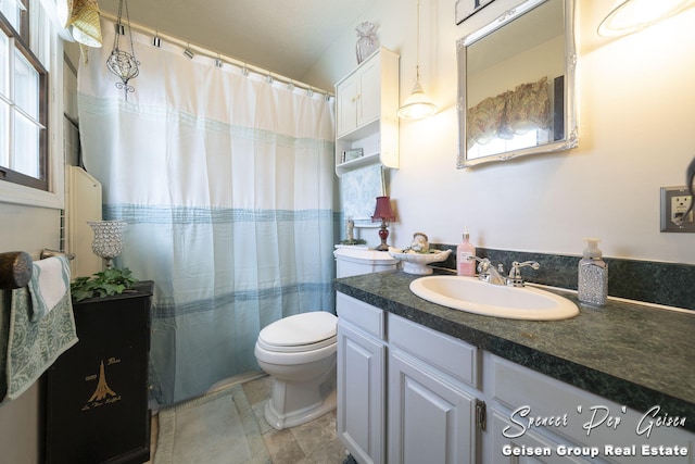 full bath with a shower with curtain, toilet, and vanity