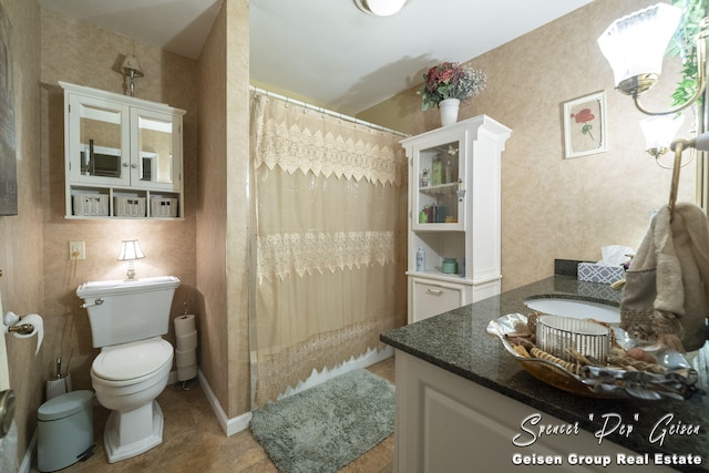 full bathroom featuring a shower with shower curtain, toilet, vanity, and tile patterned flooring