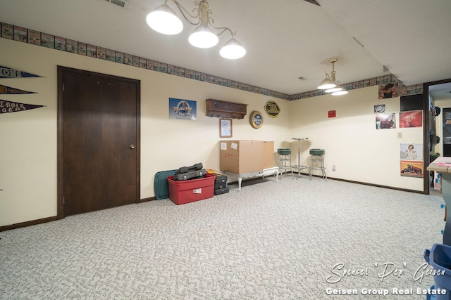 interior space with visible vents, baseboards, and carpet floors