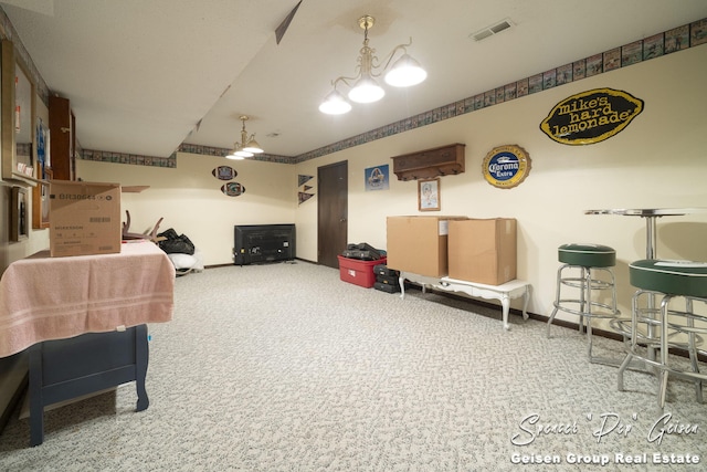 interior space featuring carpet, baseboards, and visible vents