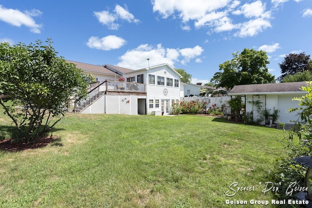 view of yard with fence and a wooden deck