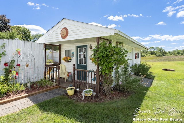 view of outbuilding featuring fence