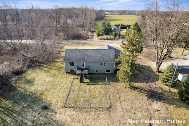 birds eye view of property featuring a rural view