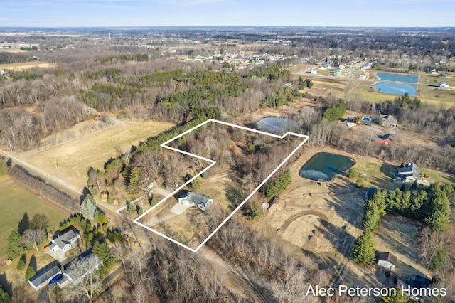 drone / aerial view featuring a rural view and a water view