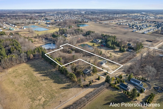 birds eye view of property featuring a rural view