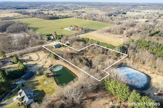 drone / aerial view with a water view and a rural view